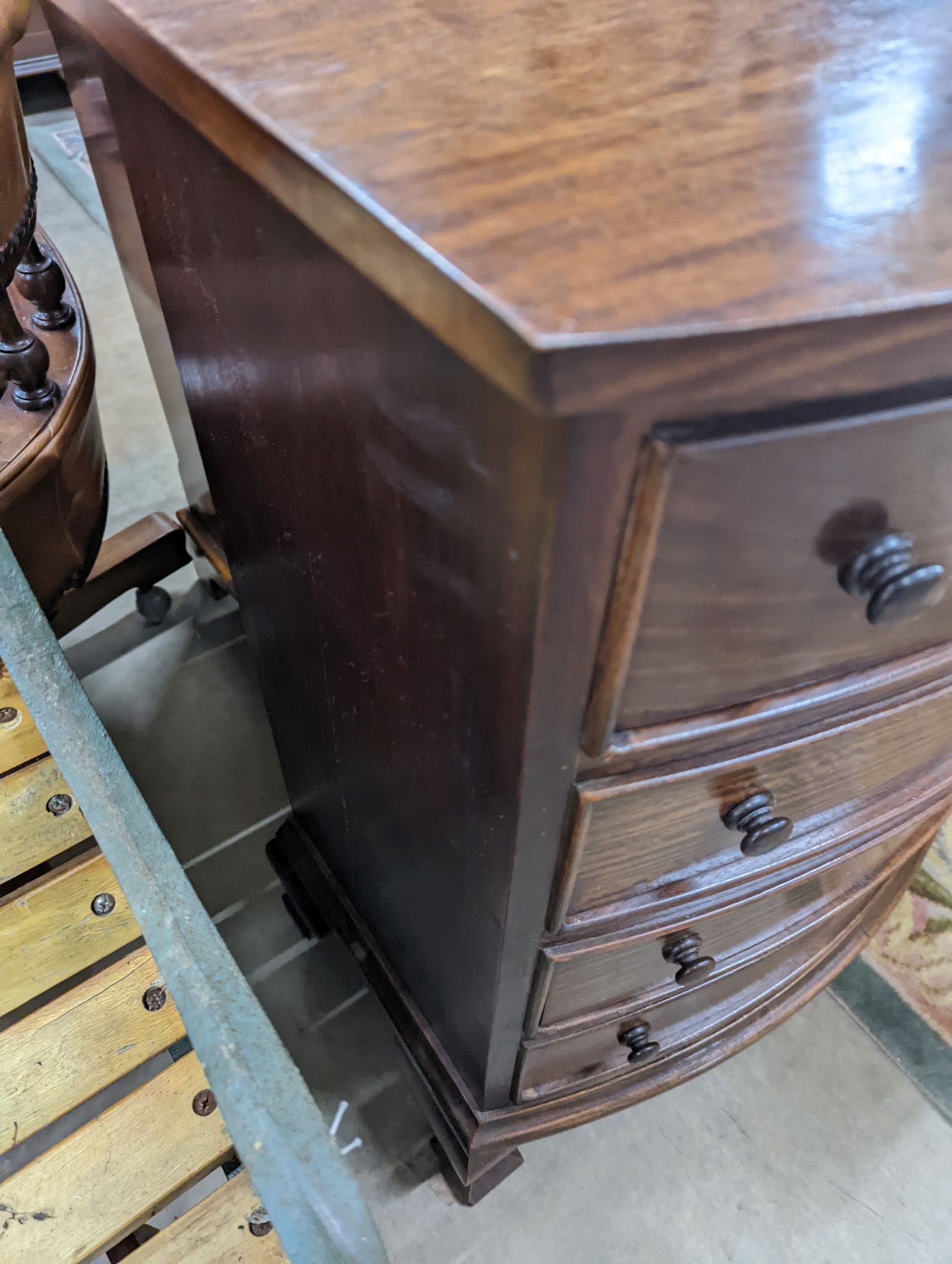 A small reproduction mahogany bow front chest of four long drawers, width 60cm, depth 38cm, height 82cm